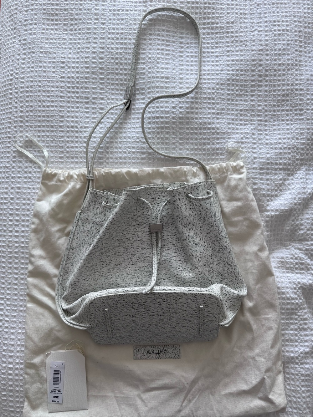 Auxiliary White Textured Drawstring Shoulder Bag